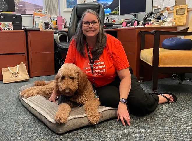 Dr. Larson and her therapy dog, Winston. 